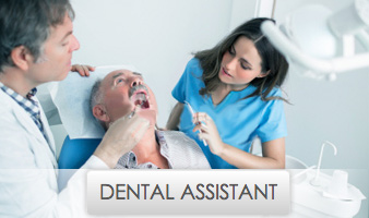 Young Female Dental Assistant Working with Dentist on Patient's Mouth